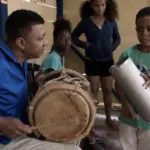 Abel Martínez playing tambora with Mailon Durineck on güira at Academia de Bachata