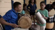 Abel Martínez playing tambora with Mailon Durineck on güira at Academia de Bachata